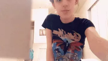Adorable teen shows off her big titties.